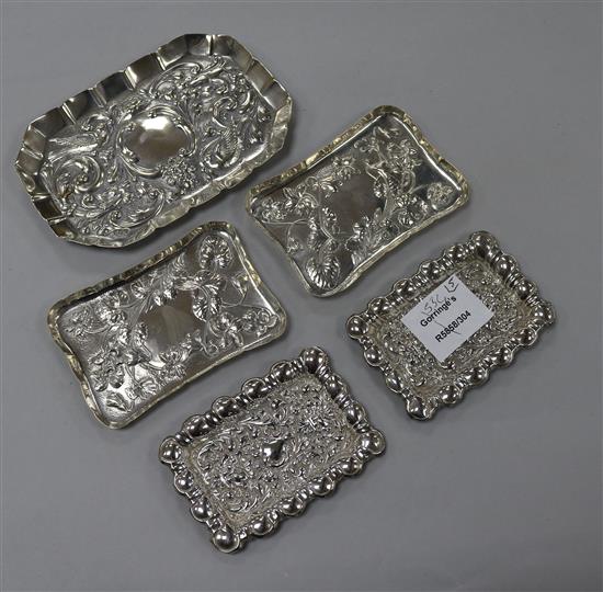 Two pairs of Edwardian repousse silver small dishes and a larger Victorian dish, maker includes William Comyns, largest 15.5cm.